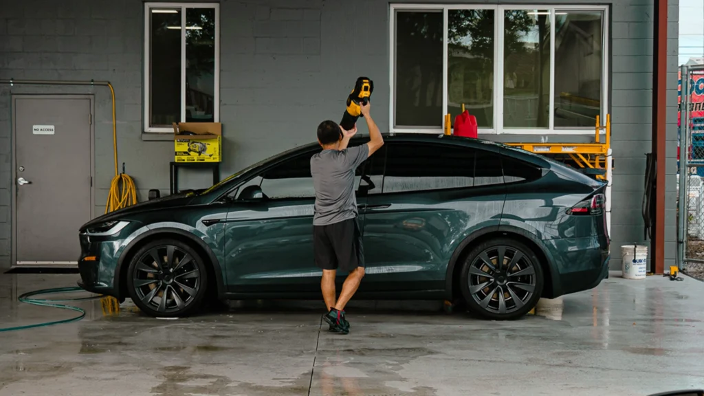 Car detailing service being performed on a Tesla Model X.